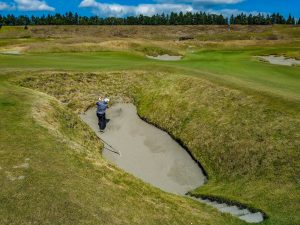 Playing partner finds the fairway bunker on 18. Known by the caddies as: The Devil's Asshole. Playing partner finds the fairway bunker on 18. Known by the caddies as: The Devil's Asshole.